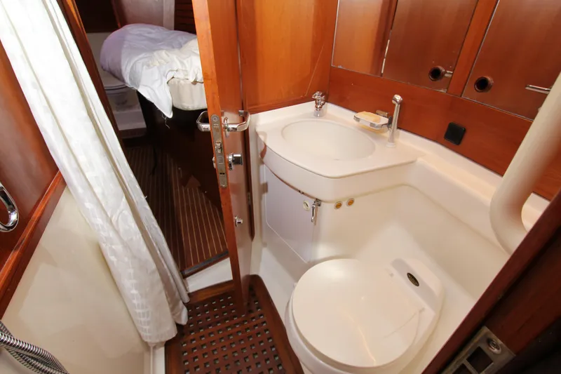 Slide: The Image of Luxurious bathroom on 2004 Nautor Swan 62 yacht with wooden accents and modern fixtures. - 25