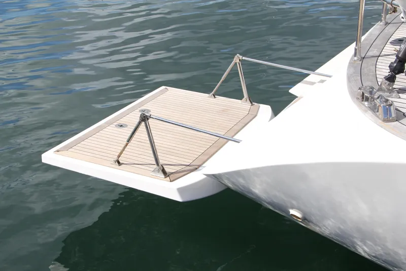 Slide: The Image of Nautor Swan 62 (2004) yacht with extended swim platform on calm water. - 3