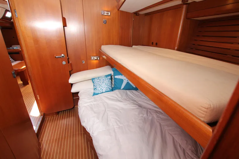 Slide: The Image of Luxurious wooden cabin interior of 2004 Nautor Swan 62 yacht with bunk beds. - 34
