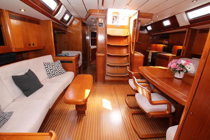 Slide: The Image of Luxurious interior of 2004 Nautor Swan 62 yacht with elegant wood finish and comfortable seating. - 35
