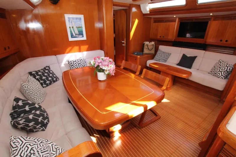Slide: The Image of Luxurious interior of 2004 Nautor Swan 62 yacht with elegant wood finish and cozy seating. - 37