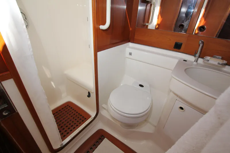 Slide: The Image of Luxurious bathroom in 2004 Nautor Swan 62 yacht with shower, toilet, and sink. - 46