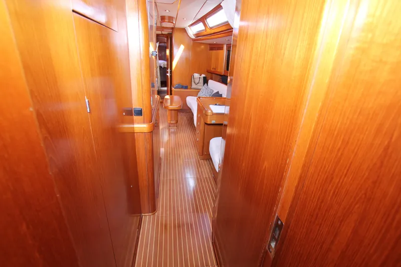 Slide: The Image of Luxurious wooden interior of 2004 Nautor Swan 62 yacht cabin hallway. - 47