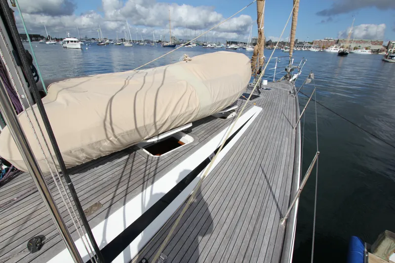 Slide: The Image of Deck view of 2004 Nautor Swan 62 yacht in a marina setting. - 9