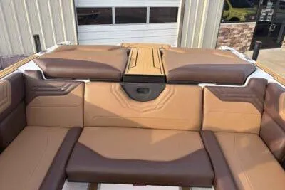 Slide: The Image of 2026 ATX Surf Boats 24 Type-S interior with tan and brown seating. - 11