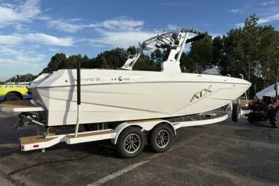 Slide: The Image of 2026 ATX Surf Boats 24 Type-S on trailer, parked outdoors. - 4