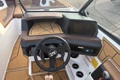 Slide: The Image of 2026 ATX Surf Boats 24 Type-S dashboard with modern steering and control panel. - 6