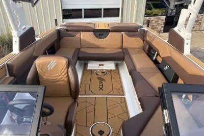 Slide: The Image of 2026 ATX Surf Boats 24 Type-S interior with luxurious brown seating and modern design. - 7