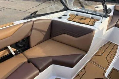 Slide: The Image of 2026 ATX Surf Boats 24 Type-S interior with brown leather seating and modern design. - 8