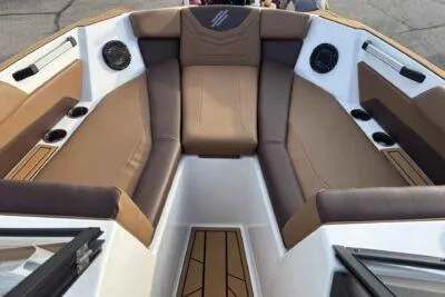 Slide: The Image of 2026 ATX Surf Boats 24 Type-S interior with brown seating and modern design. - 9