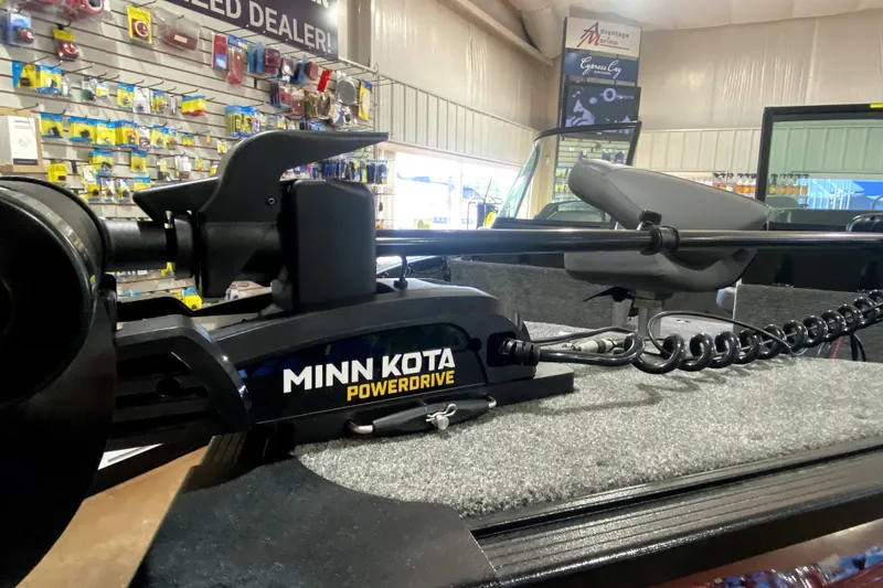 Slide: The Image of Minn Kota PowerDrive on 2026 Alumacraft Voyageur 175 Sport in a marine store. - 13