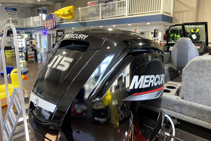 Slide: The Image of Mercury 115 outboard motor on 2026 Alumacraft Voyageur 175 Sport boat in showroom. - 3