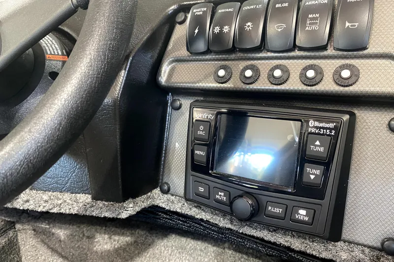 Slide: The Image of Control panel of 2026 Alumacraft Voyageur 175 Sport boat with Bluetooth stereo system. - 8