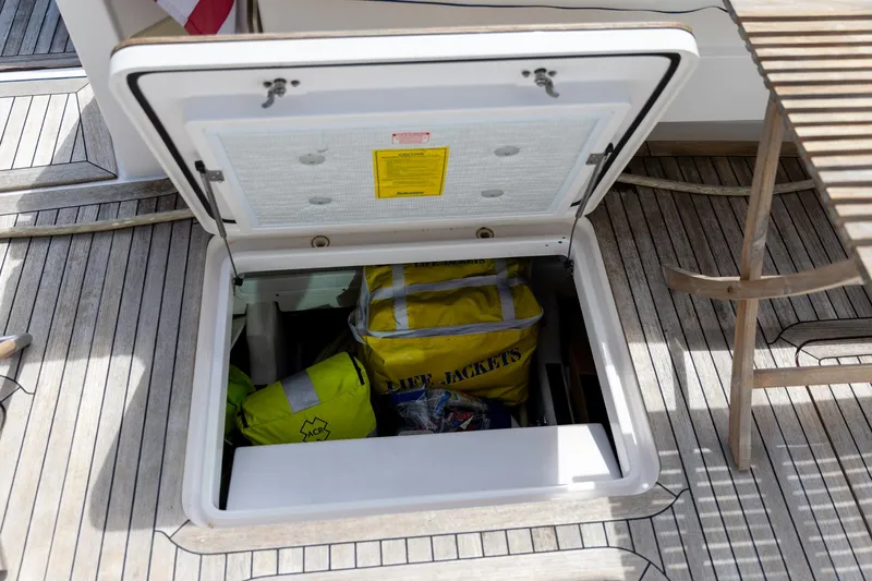 Slide: The Image of Open storage hatch on 2009 Sabre 52 Express yacht, containing life jackets. - 17