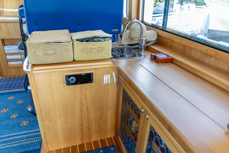 Slide: The Image of Interior of 2009 Sabre 52 Express yacht with wooden cabinetry and sink. - 22