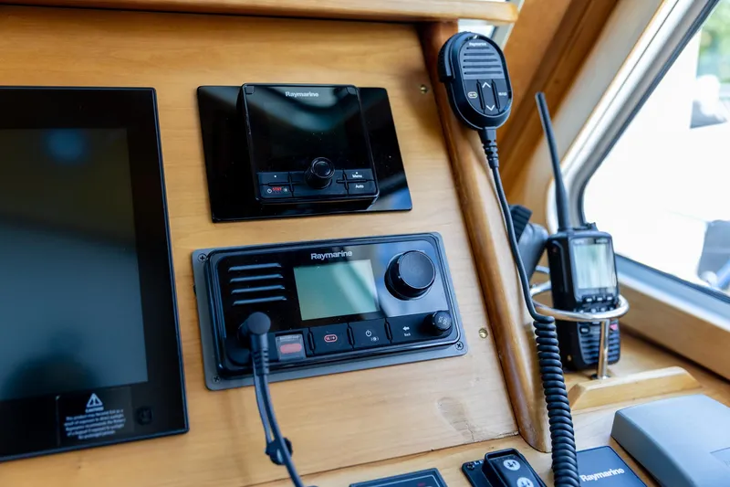 Slide: The Image of Control panel of a 2009 Sabre 52 Express yacht with navigation equipment. - 24