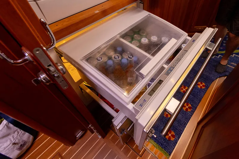 Slide: The Image of Refrigerator drawer in 2009 Sabre 52 Express yacht interior, stocked with beverages. - 29