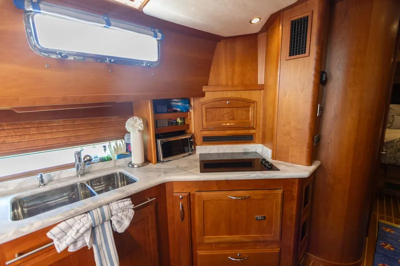 Slide: The Image of Luxurious wooden kitchen interior of 2009 Sabre 52 Express yacht with modern amenities. - 33