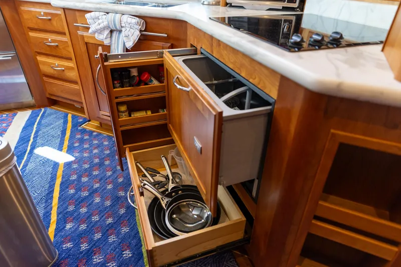 Slide: The Image of Galley kitchen in 2009 Sabre 52 Express yacht with open drawers and cookware. - 36