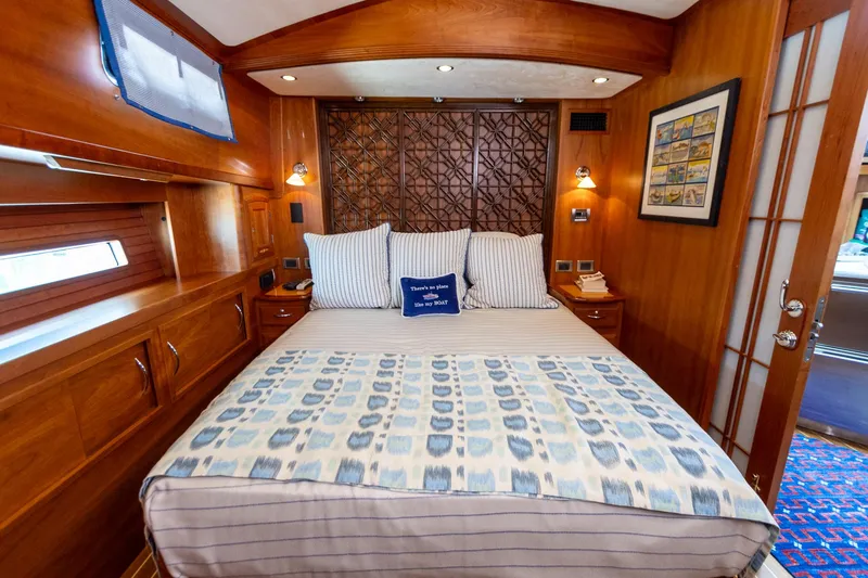 Slide: The Image of Luxurious cabin interior of 2009 Sabre 52 Express yacht with elegant bedding and wood finish. - 38