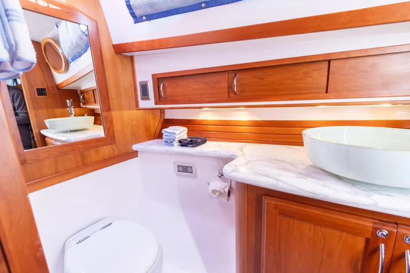 Slide: The Image of Luxurious bathroom in 2009 Sabre 52 Express yacht with wooden cabinetry and modern fixtures. - 41