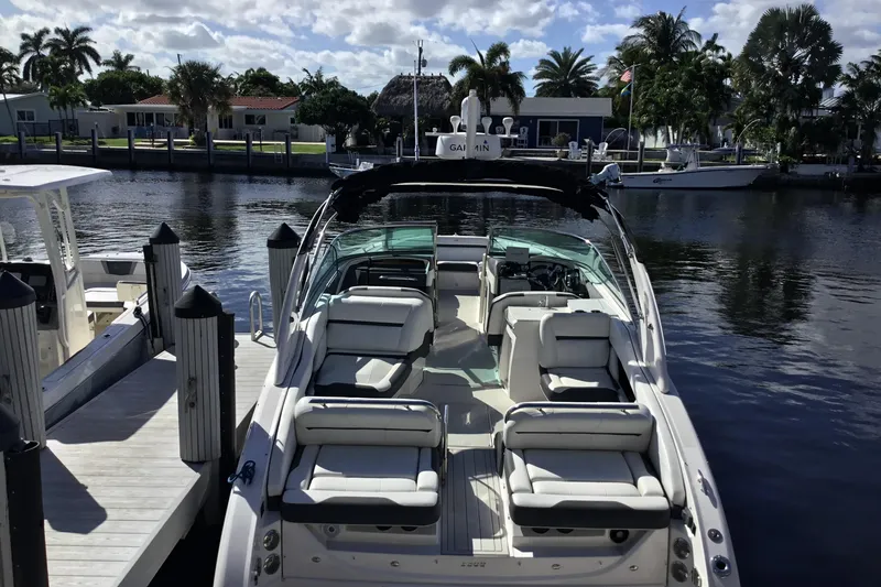 Slide: The Image of 2017 Regal 3200 Bowrider docked, featuring spacious seating and sleek design. - 19