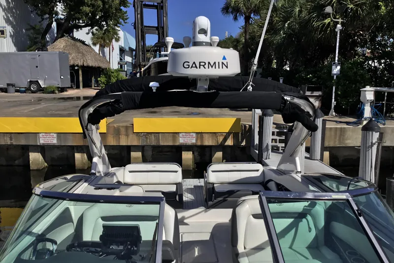 Slide: The Image of 2017 Regal 3200 Bowrider boat docked with Garmin equipment visible. - 22