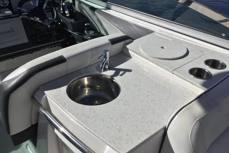Slide: The Image of 2017 Regal 3200 Bowrider boat interior with sink and countertop. - 33