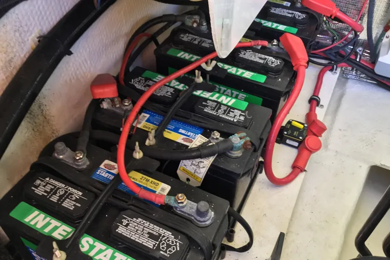 Slide: The Image of Batteries and wiring inside a 2017 Regal 3200 Bowrider boat. - 54