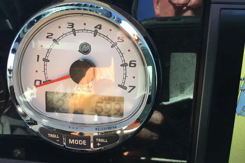Slide: The Image of Close-up of a 2017 Regal 3200 Bowrider tachometer displaying RPM and engine hours. - 59