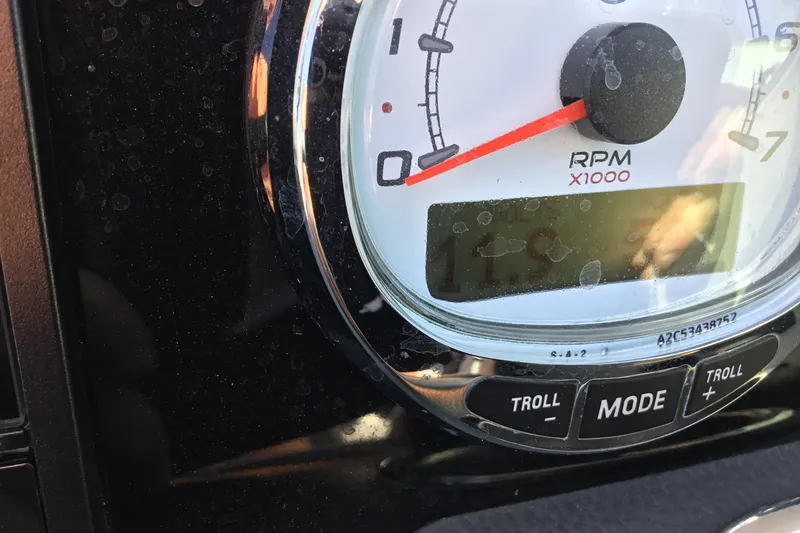 Slide: The Image of Close-up of 2017 Regal 3200 Bowrider RPM gauge with digital display and control buttons. - 61