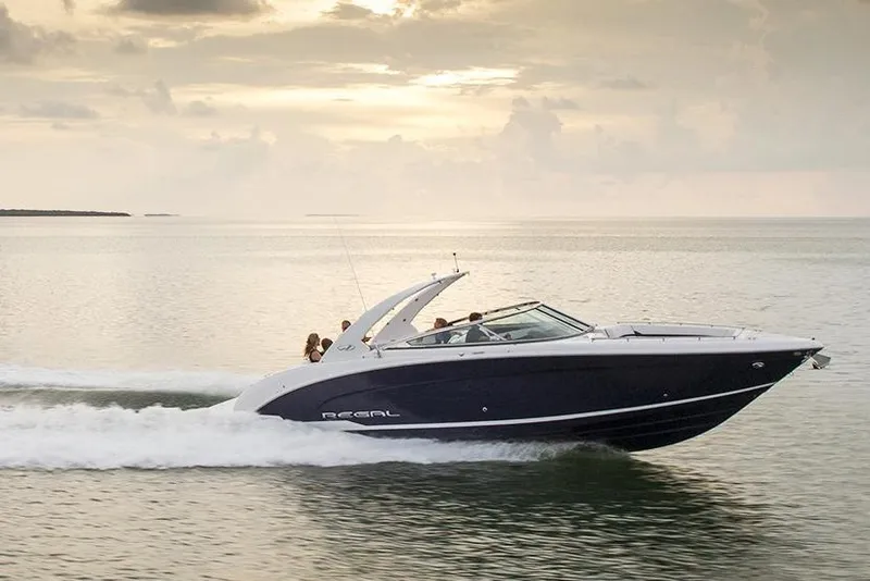 Slide: The Image of Manufacturer Provided Image: 2017 Regal 3200 Bowrider cruising on calm waters at sunset. - 67