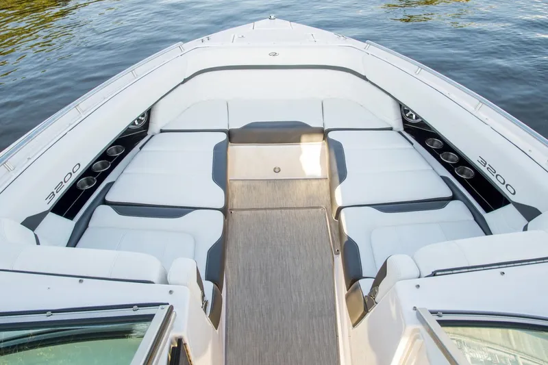 Slide: The Image of Manufacturer Provided Image: 2017 Regal 3200 Bowrider boat with spacious seating area on calm water. - 72
