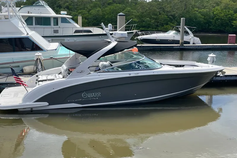 Slide: The Image of 2017 Regal 3200 Bowrider boat docked, featuring sleek design and modern amenities. - 79