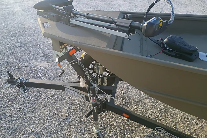 Slide: The Image of 2026 G3 Gator Tough 16 FL boat on trailer with motor and chains. - 4