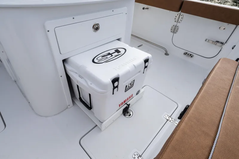 Slide: The Image of 2026 Sea Hunt Ultra 285 SE boat interior with cooler storage. - 10