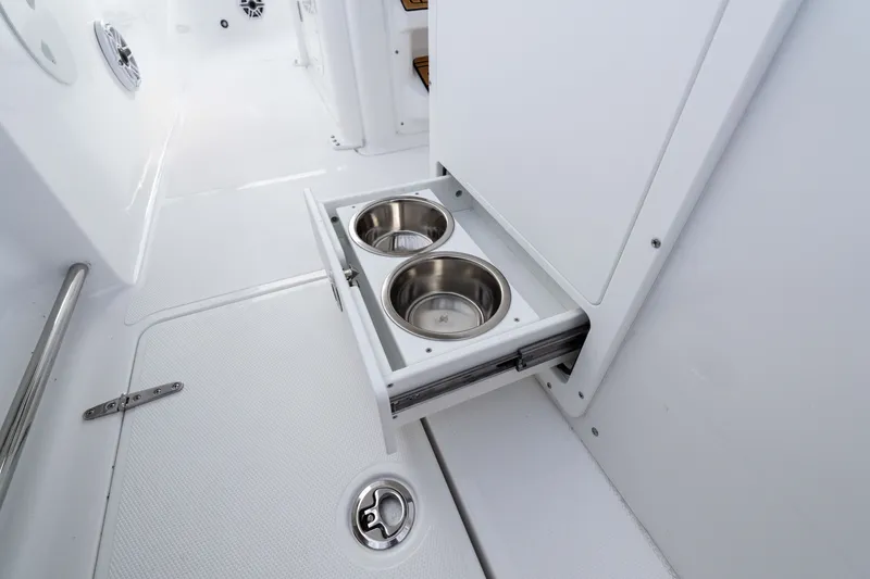 Slide: The Image of 2026 Sea Hunt Ultra 285 SE boat with built-in stainless steel cup holders. - 12