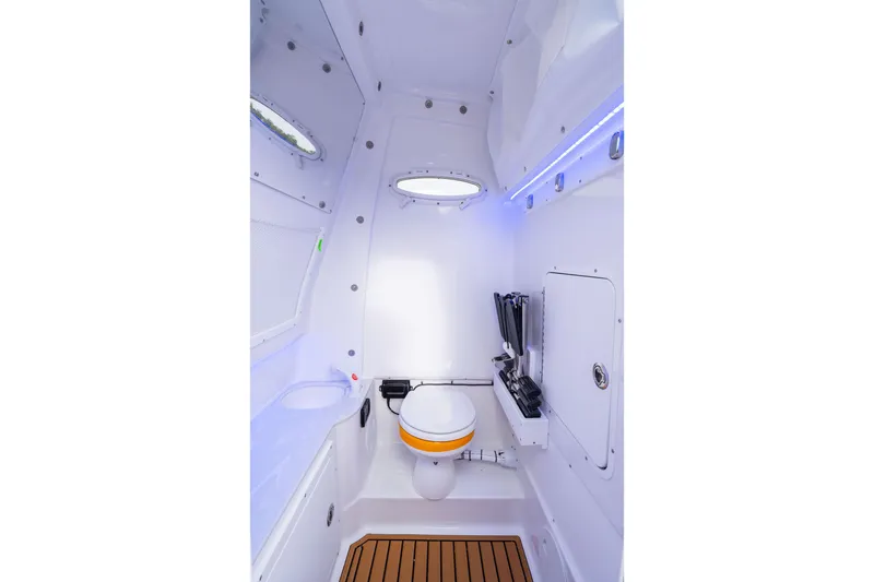 Slide: The Image of Interior of 2026 Sea Hunt Ultra 285 SE boat, featuring a compact, modern bathroom. - 6