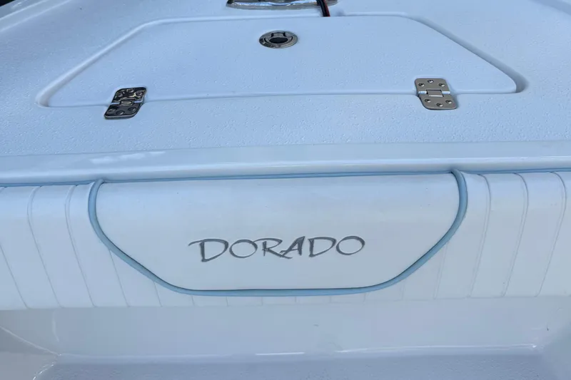 Slide: The Image of 2022 Dorado 25 Flat Deck boat, white deck with storage hatch and logo. - 18