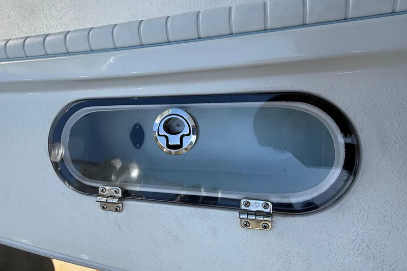 Slide: The Image of 2022 Dorado 25 Flat Deck boat hatch with secure latch and sleek design. - 21