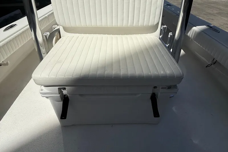 Slide: The Image of 2022 Dorado 25 Flat Deck boat seat with white cushioned upholstery. - 24