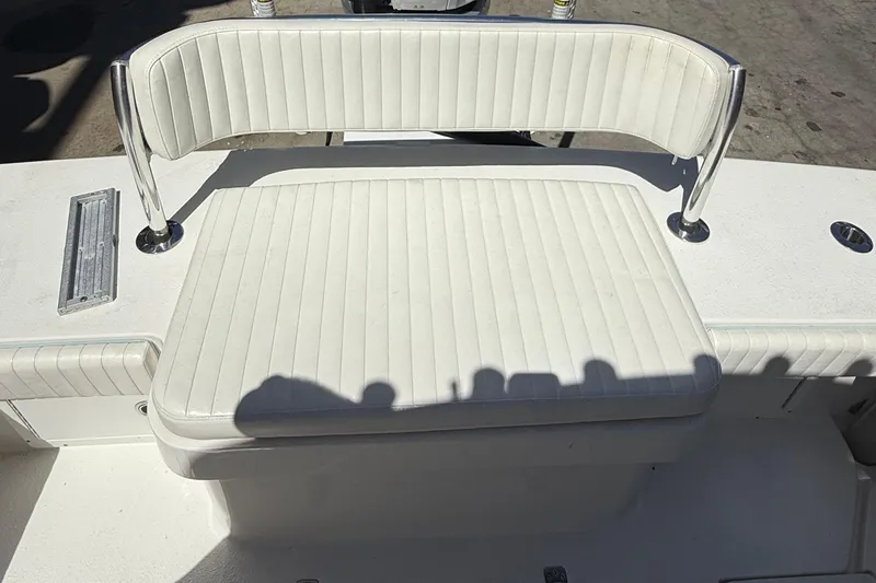 Slide: The Image of 2022 Dorado 25 Flat Deck boat with white cushioned seating and stainless steel supports. - 28