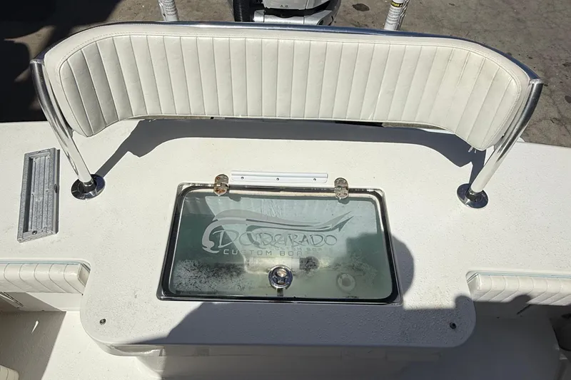 Slide: The Image of 2022 Dorado 25 Flat Deck boat with custom seating and storage compartment. - 29