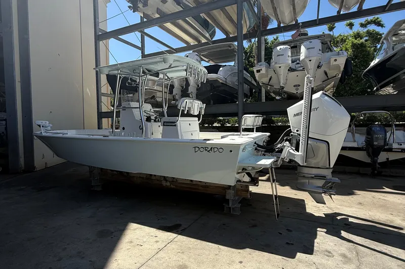 Slide: The Image of 2022 Dorado 25 Flat Deck boat with Mercury engine in storage facility. - 3