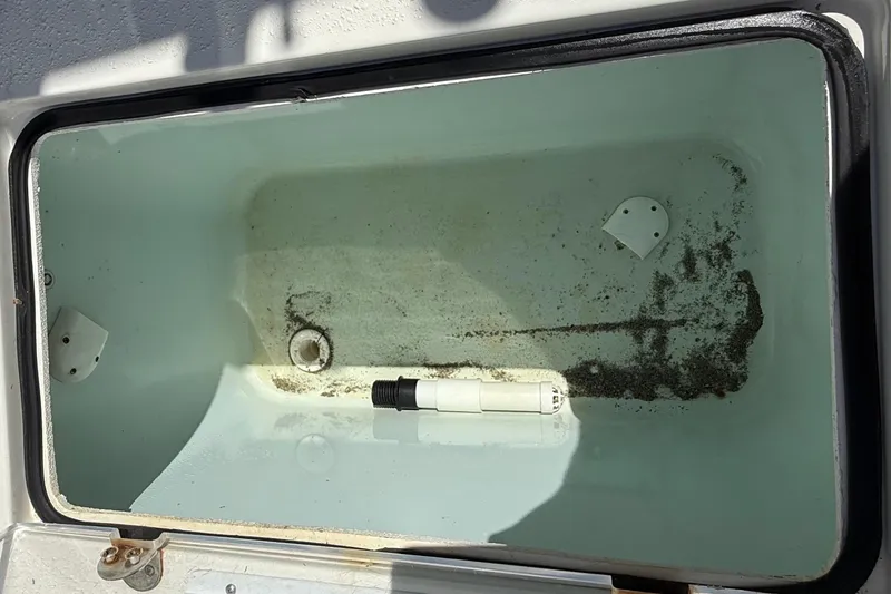 Slide: The Image of Open storage compartment on 2022 Dorado 25 Flat Deck boat, showing interior details. - 30