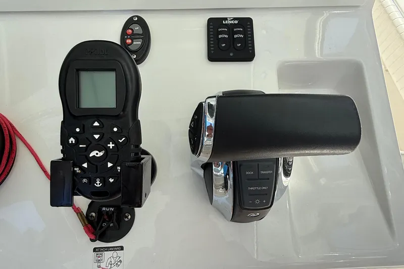 Slide: The Image of Control panel of 2022 Dorado 25 Flat Deck boat with throttle and navigation controls. - 36