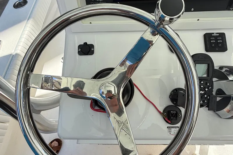 Slide: The Image of Steering wheel of 2022 Dorado 25 Flat Deck boat with control panel. - 37