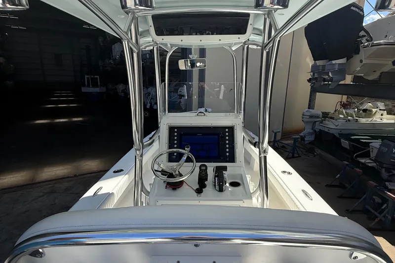 Slide: The Image of 2022 Dorado 25 Flat Deck boat interior with steering console and navigation equipment. - 52