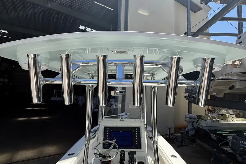 Slide: The Image of 2022 Dorado 25 Flat Deck boat with stainless steel rod holders and modern console. - 53