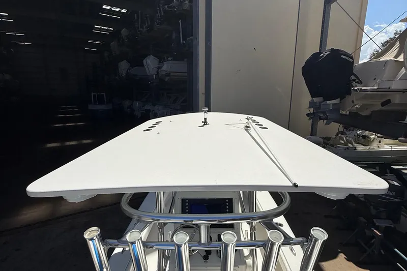 Slide: The Image of 2022 Dorado 25 Flat Deck boat in a storage facility, showcasing its sleek design. - 56